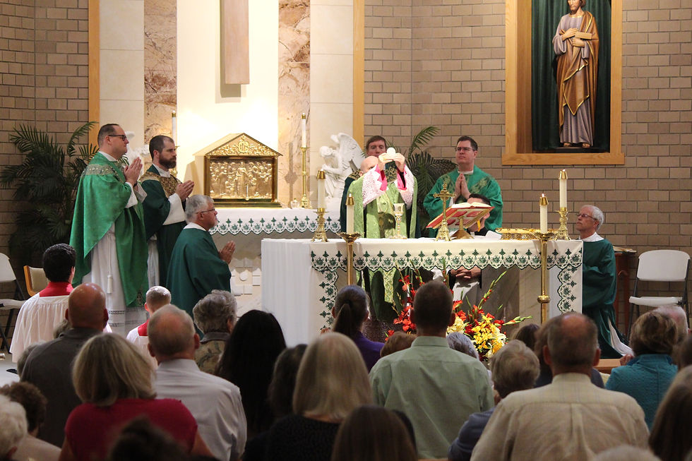 Archbishop Aquila celebrates Mass with Father Gregg and other priests and deacons